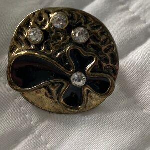 Gold tone and black enamel ring